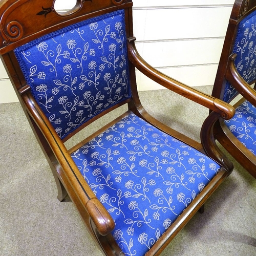 349N - A pair of Regency carved mahogany elbow chairs