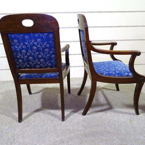 349N - A pair of Regency carved mahogany elbow chairs