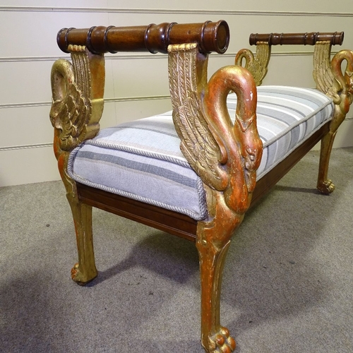 349P - An Empire style carved giltwood framed window seat, with swan supports and upholstered squab cushion... 