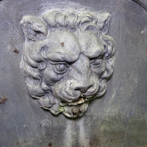 349T - A heavy semi-circular lead fountain with lion spout, width 2'7