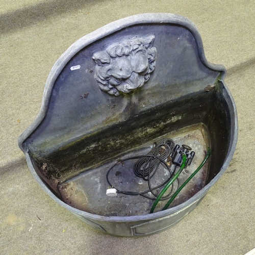 349T - A heavy semi-circular lead fountain with lion spout, width 2'7