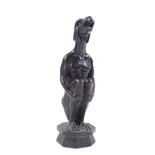 121 - A patinated bronze sculpture of a crouching eagle-headed figure, unsigned, height 19cm