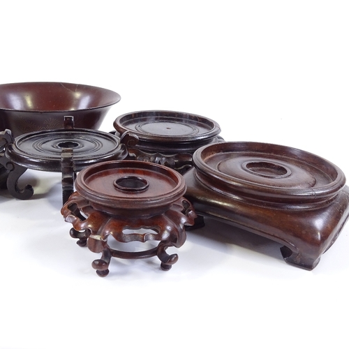 128 - A collection of Chinese hardwood stands, and a lacquer bowl, diameter 14.5cm