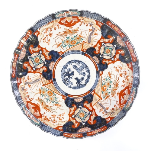 132 - A large Chinese porcelain Imari pattern charger, hand painted and gilded decoration, diameter 46cm, ... 