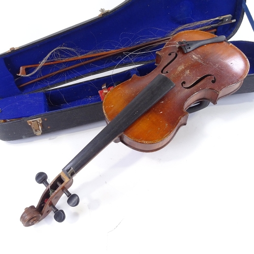 140 - An early 20th century violin, back length 35.5cm, with 2 bows and case