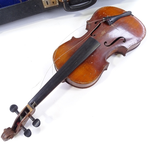 140 - An early 20th century violin, back length 35.5cm, with 2 bows and case