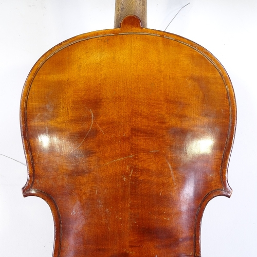 140 - An early 20th century violin, back length 35.5cm, with 2 bows and case