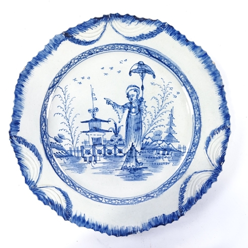 166 - A 19th century Pearlware plate, decorated with an Oriental figure in landscape, no factory marks, di... 