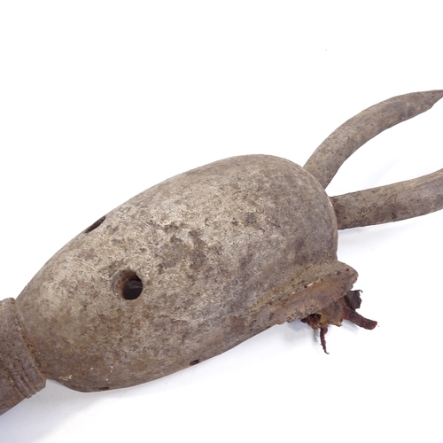 185 - A 19th century African Lega carved and painted wood Tribal mask with horns, height 75cm