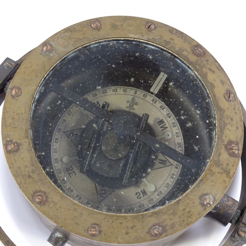 188 - A brass-cased ship's compass in gimballed mount, serial no. 2958E