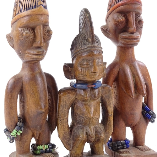 193 - 3 African Yoruba Ibejis, carved wood with bead mounts, height 30cm