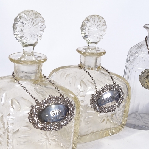 29 - 5 various 19th century cut-glass decanters, all with silver or electroplate labels (5)