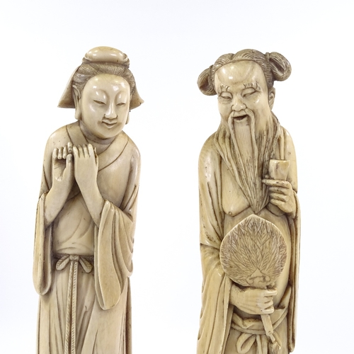 4 - A pair of large Japanese ivory okimono, man holding a fan and a woman, Meiji Period circa 1900, on c... 
