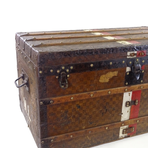 43 - A Louis Vuitton wood and metal-bound Vintage travelling trunk, original chequer design ground with o... 