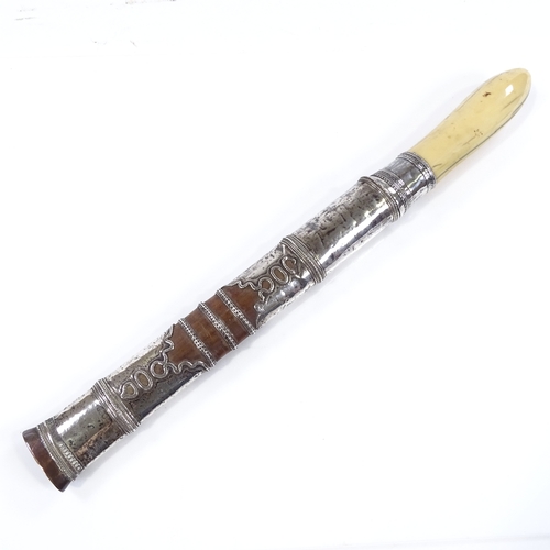 52 - A Burmese silver-mounted dagger, circa 1900, with ivory hilt and original silver-mounted wood scabba... 