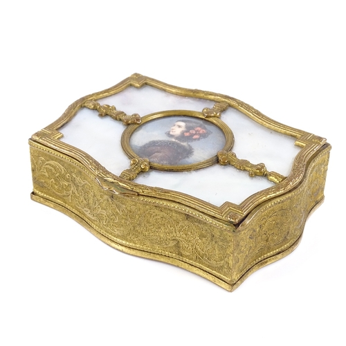 74 - An ornate gilt-metal jewel box, circa 1900, the lid having a watercolour miniature portrait of a wom... 