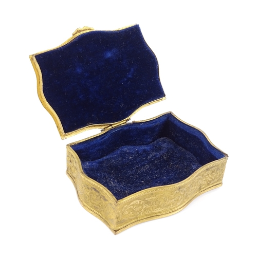 74 - An ornate gilt-metal jewel box, circa 1900, the lid having a watercolour miniature portrait of a wom... 