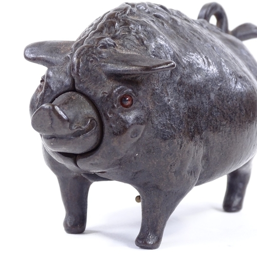 8 - A Victorian bronze butcher's shop counter bell in the form of a pig, with clockwork mechanism in wor... 