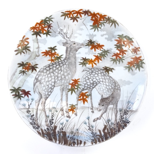 90 - A Japanese porcelain plate with hand painted study of 2 deer, diameter 31cm