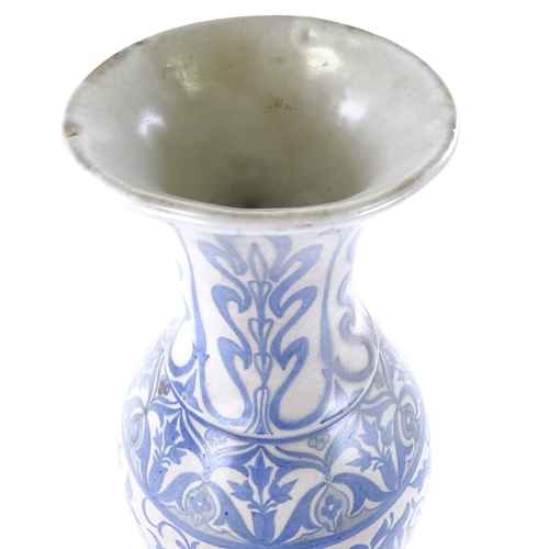 95 - A Middle Eastern Islamic white glaze vase with painted blue floral decoration, height 55cm, rim diam... 