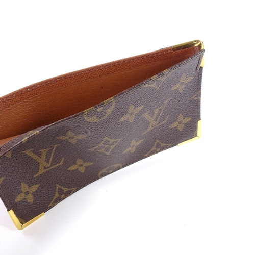 97 - A Louis Vuitton monogram card holder/wallet, serial no. 873/RA, 15cm x 9cm