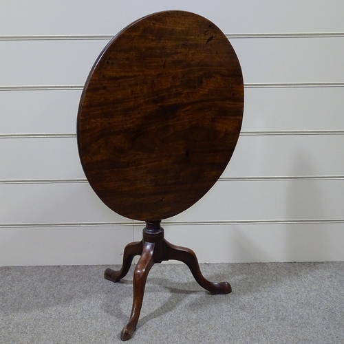 329 - An early 19th century circular mahogany tilt-top tea table on tripod base, 29.5