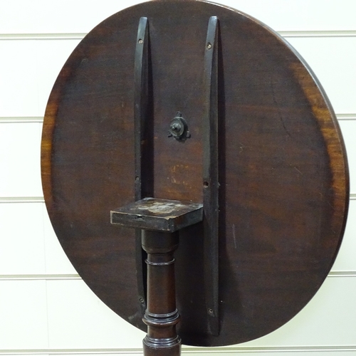 329 - An early 19th century circular mahogany tilt-top tea table on tripod base, 29.5