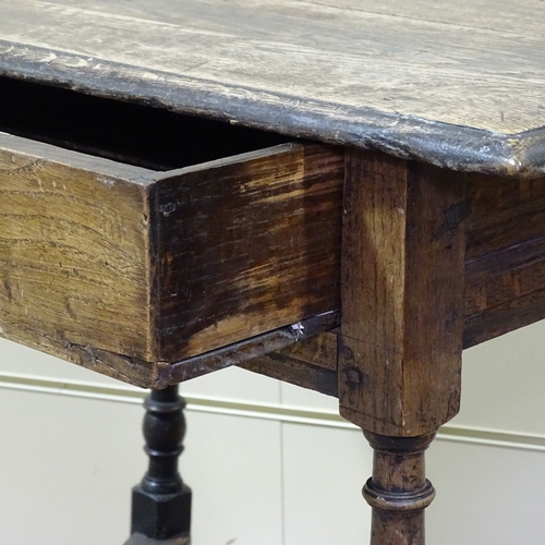 330 - An Antique joined oak side table, with single frieze drawer and shaped cross-stretcher, width 2'10