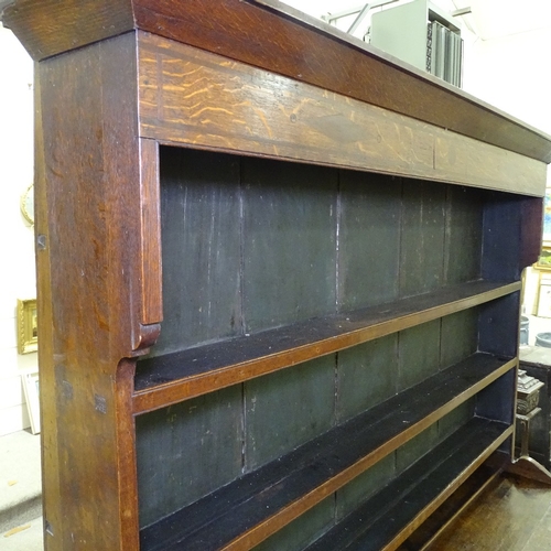 335 - A George III oak and mahogany break-front Anglesea Welsh dresser, with boarded open plate rack and d... 