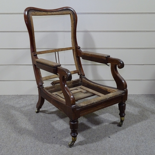 336 - An early 19th century Daws type mahogany-framed reclining library armchair with pull-out leg rest, f... 