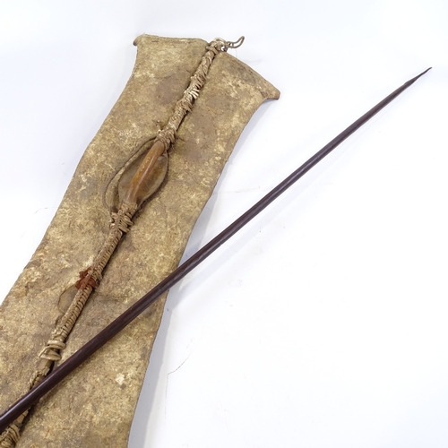 186 - An African leather-fronted Tribal shield, panel height 89cm, and a steel-tipped spear