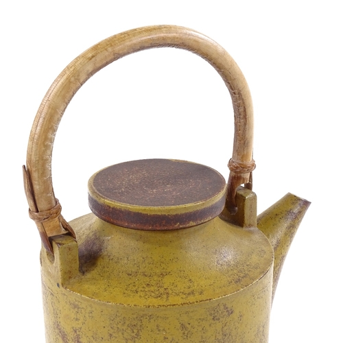 228 - Robin Welch, Studio pottery teapot with cane handle, incised signature, height to lid 17.5cm