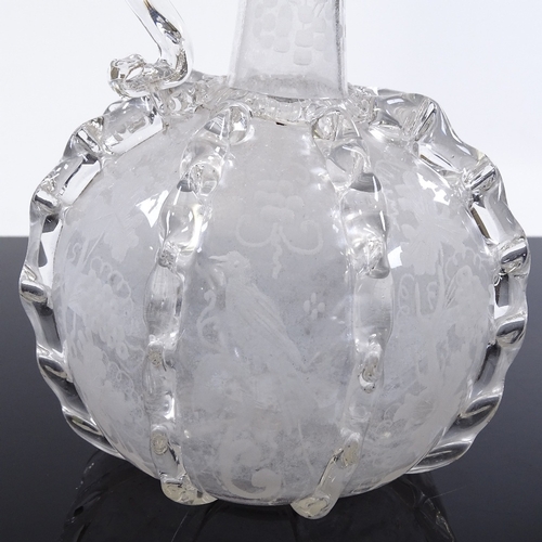 238 - A Venetian style clear glass wine flagon, with vertical trials and engraved birds, height 20cm