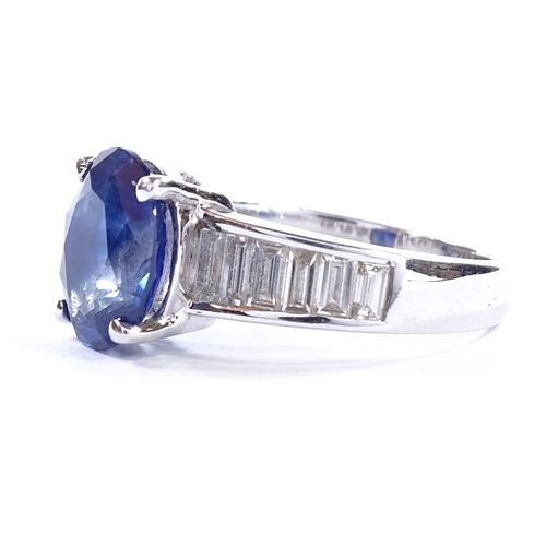 451 - An unmarked white gold sapphire and baguette-cut diamond ring, oval-cut sapphire approx 4ct, total d... 