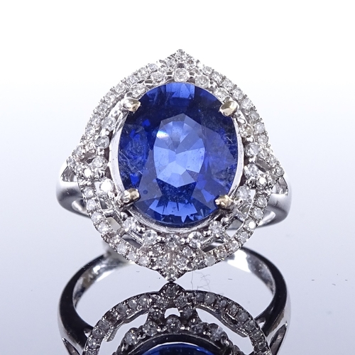 457 - A 14ct white gold sapphire and diamond cluster ring, oval-cut sapphire approx 4.5ct, pierced setting... 