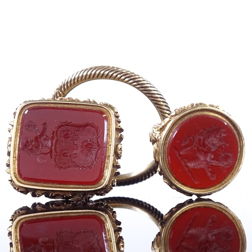 458 - 2 19th century unmarked yellow metal carnelian intaglio seal fobs, both depicting rampant lion holdi... 