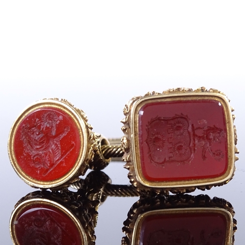 458 - 2 19th century unmarked yellow metal carnelian intaglio seal fobs, both depicting rampant lion holdi... 