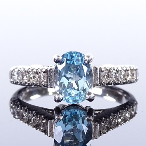 460 - An 14ct white gold aquamarine and diamond dress ring, total diamond content approx 0.4ct, setting he... 