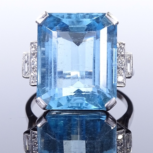 461 - An Art Deco style large aquamarine and diamond dress ring, with round and baguette-cut stepped diamo... 