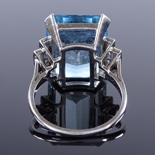 461 - An Art Deco style large aquamarine and diamond dress ring, with round and baguette-cut stepped diamo... 