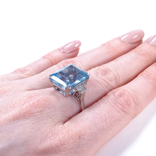 461 - An Art Deco style large aquamarine and diamond dress ring, with round and baguette-cut stepped diamo... 