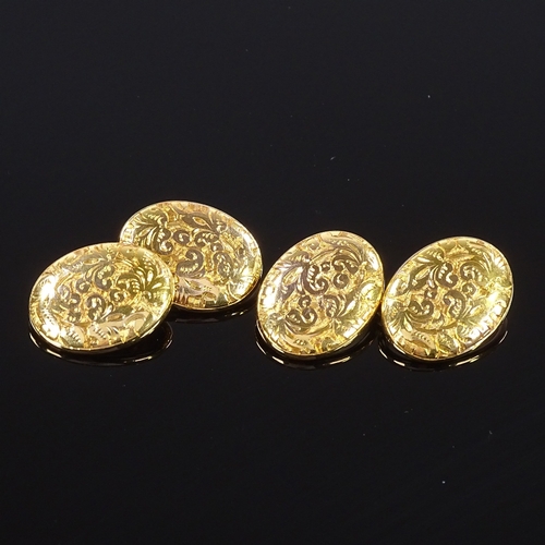 465 - A pair of 10ct gold oval cufflinks, foliate engraved panels, panel length 17.3mm, 5.2g