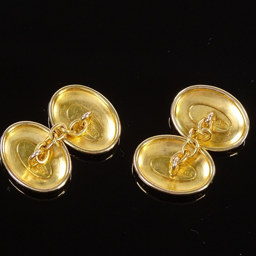 465 - A pair of 10ct gold oval cufflinks, foliate engraved panels, panel length 17.3mm, 5.2g