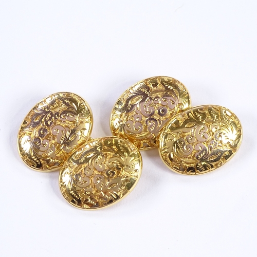 465 - A pair of 10ct gold oval cufflinks, foliate engraved panels, panel length 17.3mm, 5.2g