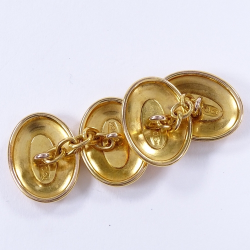 465 - A pair of 10ct gold oval cufflinks, foliate engraved panels, panel length 17.3mm, 5.2g