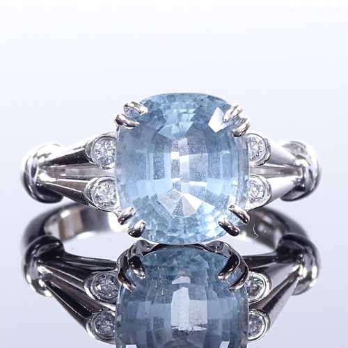 466 - An 18ct white gold aquamarine and diamond dress ring, openwork shoulders and bridge, setting height ... 