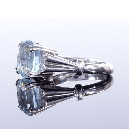 466 - An 18ct white gold aquamarine and diamond dress ring, openwork shoulders and bridge, setting height ... 