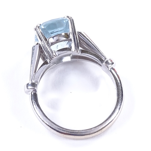 466 - An 18ct white gold aquamarine and diamond dress ring, openwork shoulders and bridge, setting height ... 