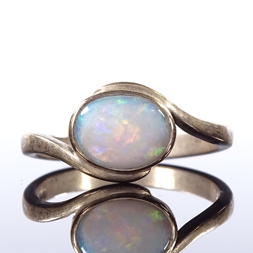 468 - A 9ct gold opal dress ring, crossover style settings, setting height 9.5mm, size Q, 3g