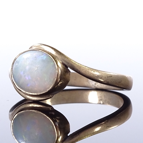 468 - A 9ct gold opal dress ring, crossover style settings, setting height 9.5mm, size Q, 3g